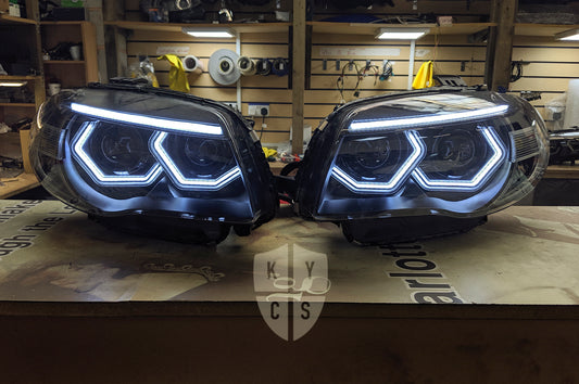 Headlight options on the above vehicle: BavGruppe Design (white) angel eyes | Modern blackout | Bi-LED 2.5" projector with LED bulb | Move high beam to low beam bi-LED projector | High beam dummy projector | Upgraded eyebrow (switchback) | LED indicators